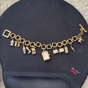 Burberry  Charm Watch --Gold no bag or box. Authentic selling for tuition fees.